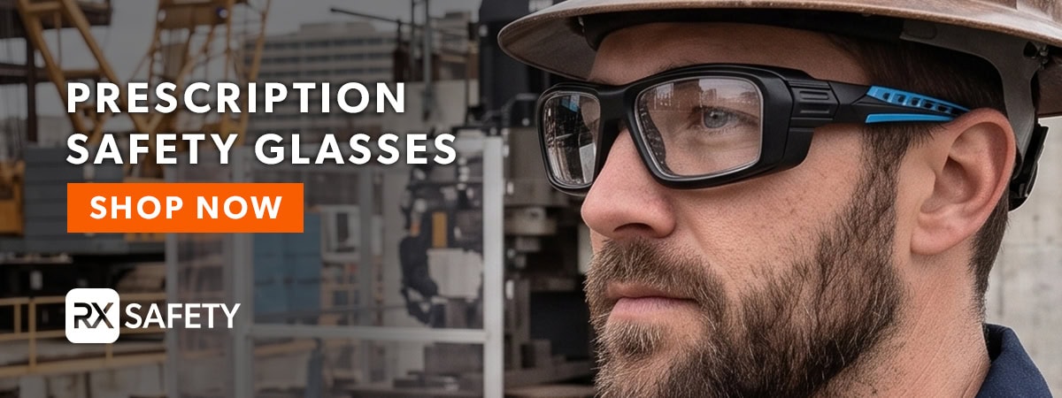 Man wearing prescription safety glasses in industrial setting.